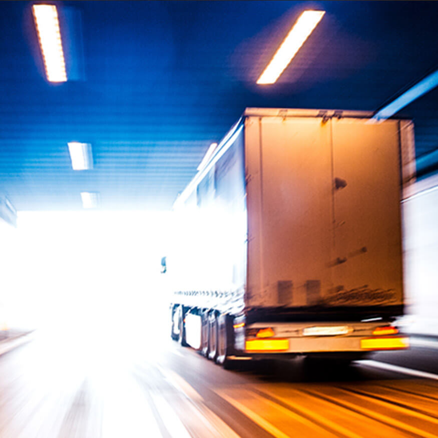 Back view of a semi-truck in a tunnel